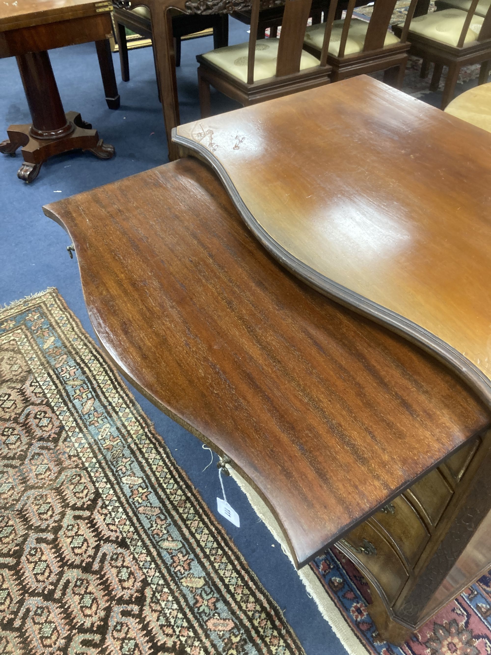 An early 20th century George III style mahogany serpentine chest of drawers with brushing slide, width 84cm, depth 54cm, height 83cm